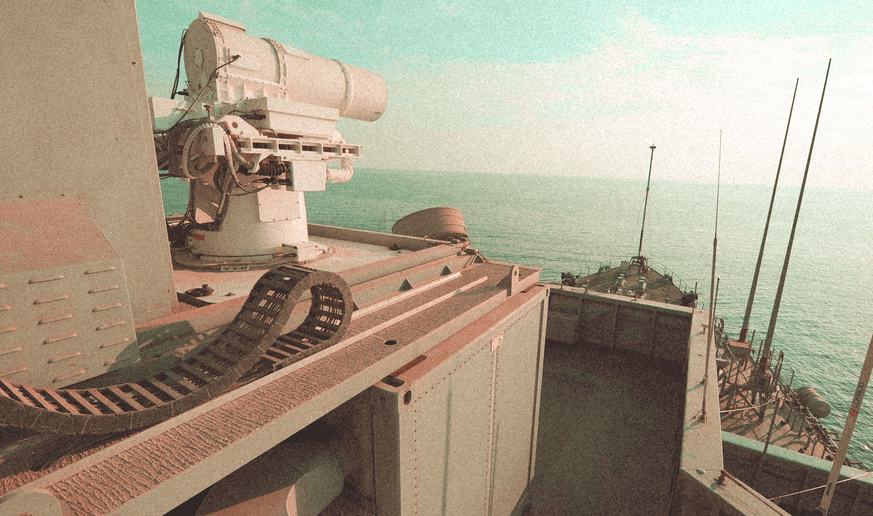 Sailors working on the gun deck of a naval vessel